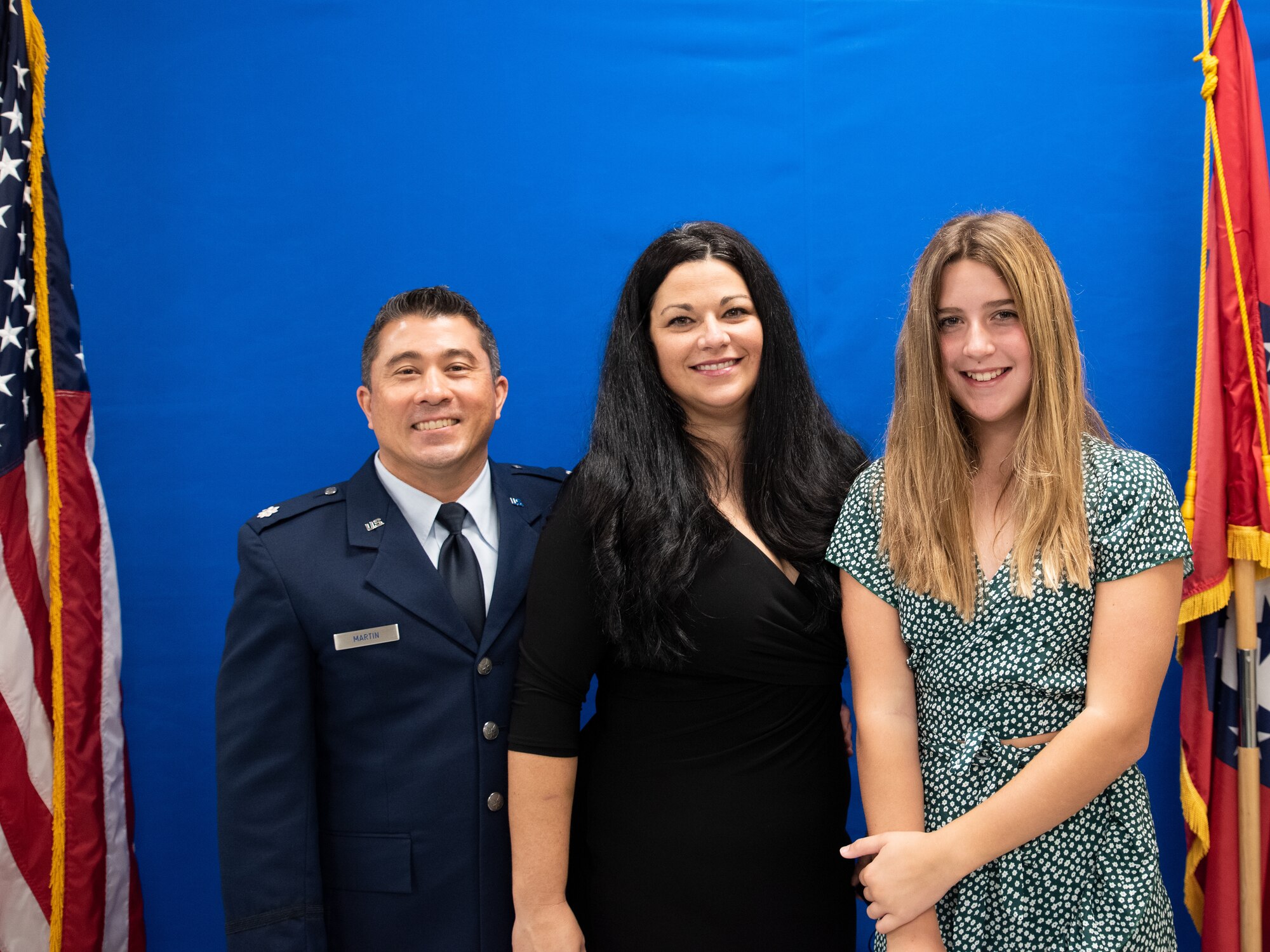 Lt. Col Michael P. Martin stands with his family at an ISRG Change of Command.