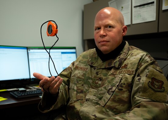 U.S. Air Force Senior Master Sgt. Jason Billingsley, the superintendent for the 442d Sustainment Services Flight, is photographed with a stopwatch