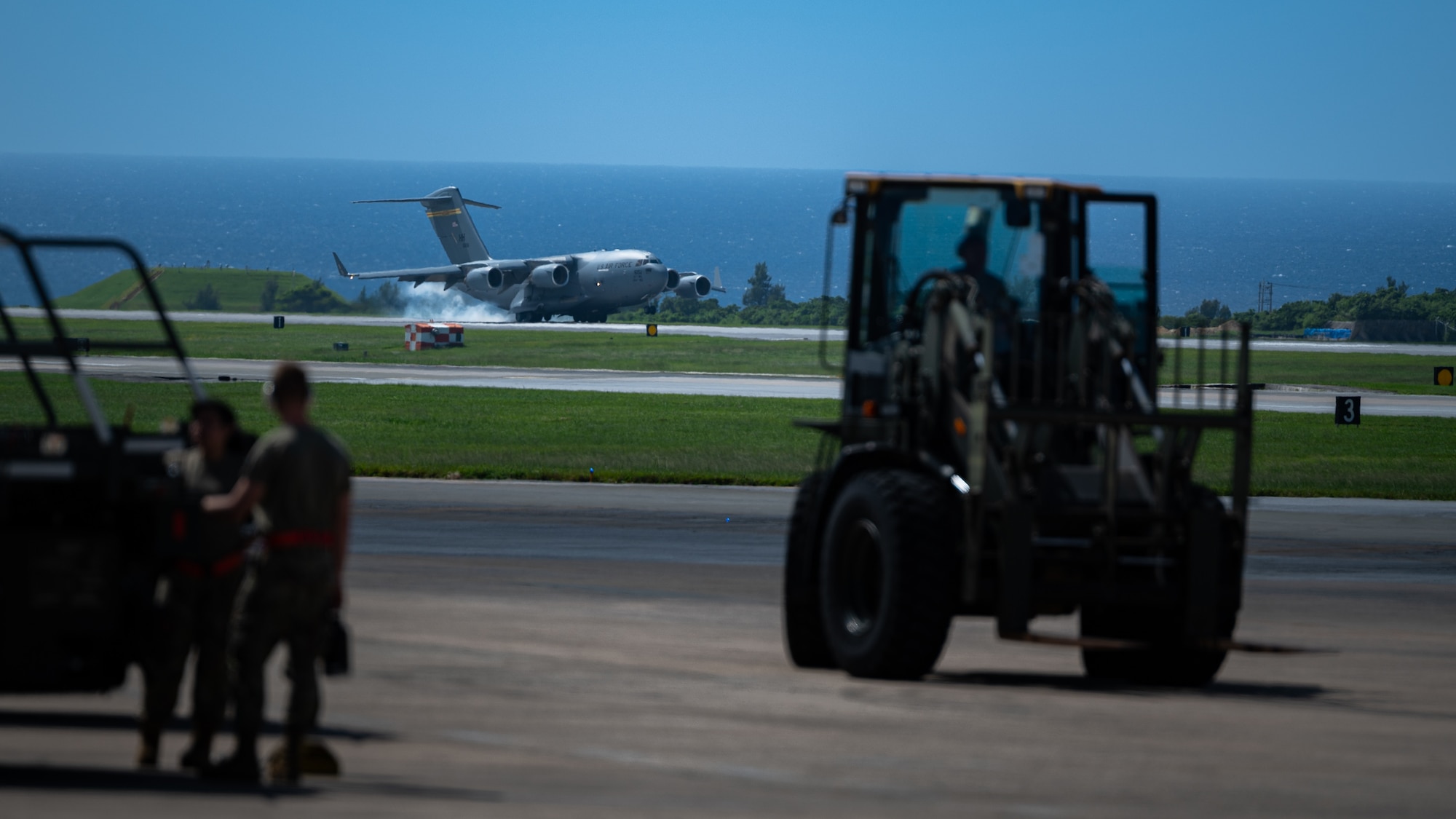 A Joint Base Pearl-Harbor Hickam C-17 Globemaster III lands at Kadena Air Base, Japan, Sept. 29, 2021. The C-17 Globemaster III has a maximum payload of 170,900 pounds, and this aircraft transported passengers and packages for Kadena Air Base residents.. (U.S. Air Force photo by Airman 1st Class Stephen Pulter)