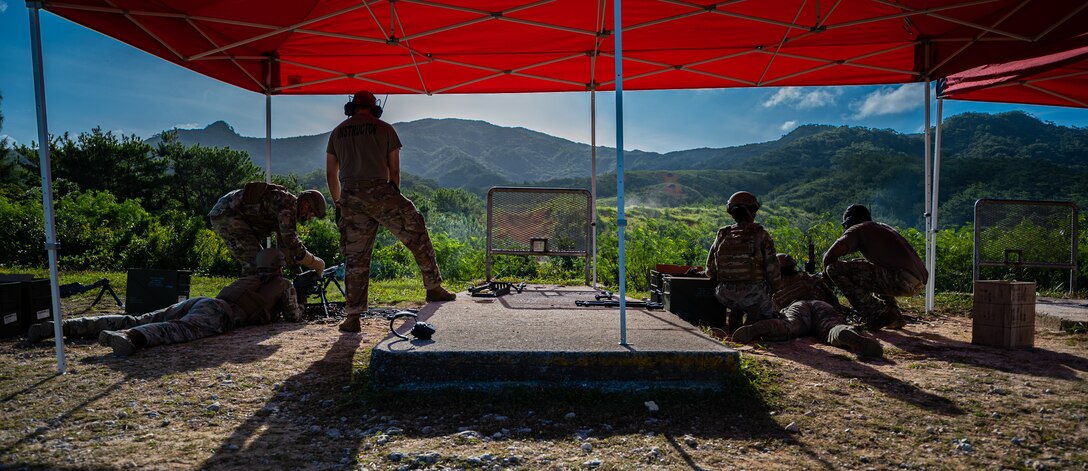 Members from the 18th Security Forces Squadron fire M240B machine guns at Camp Hansen, Japan, Sept. 30, 2021. This training was to familiarize Airmen with heavy weapon platforms to ensure safe and efficient operations. (U.S. Air Force photo by Airman 1st Class Stephen Pulter)