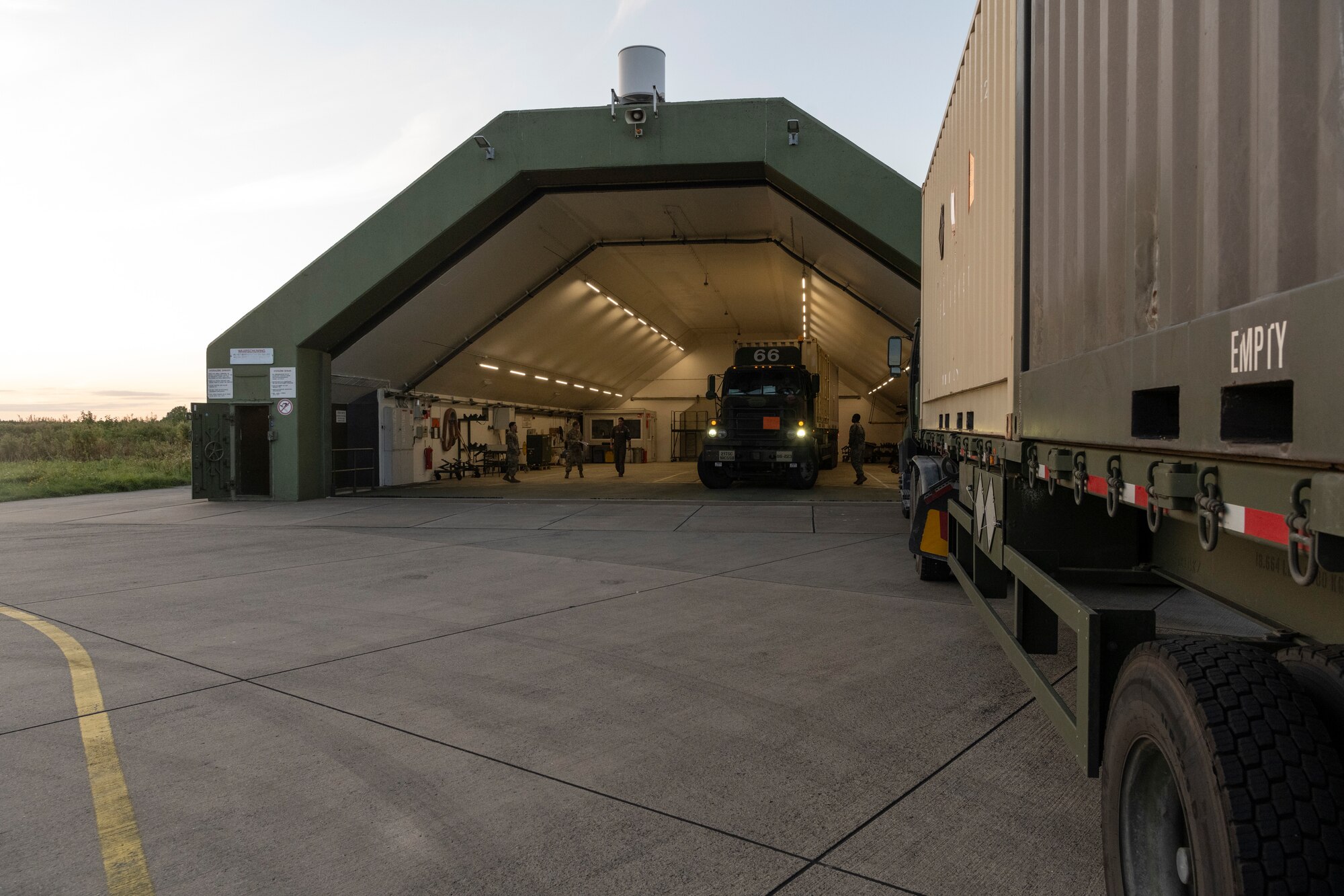 U.S. Army Soldiers with the 21st Theater Sustainment Command deliver 22 tons of cargo to 52nd Fighter Wing personnel at Leeuwarden Air Base, Netherlands, September 13. 2021. Personnel from both Germany and the Netherlands assisted in the process during the short-notice Agile Combat Employment exercise, which demonstrates the wing’s capability to support NATO allies and partners. (U.S. Air Force photo by Tech. Sgt. Anthony Plyler)