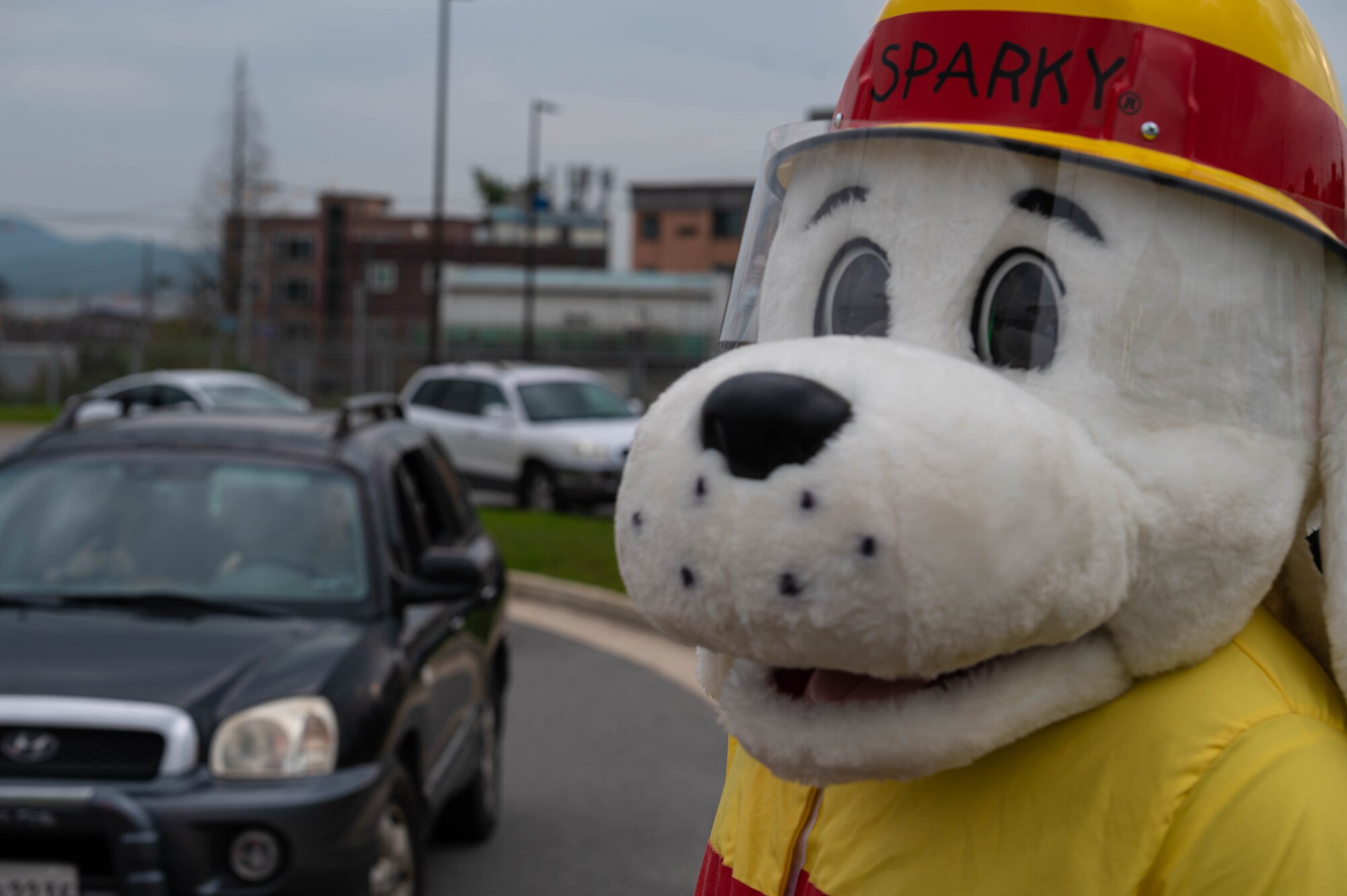 The 51st Fighter Wing Fire Department mascot “Sparky” stands outside the Morin Gate at Osan Air Base