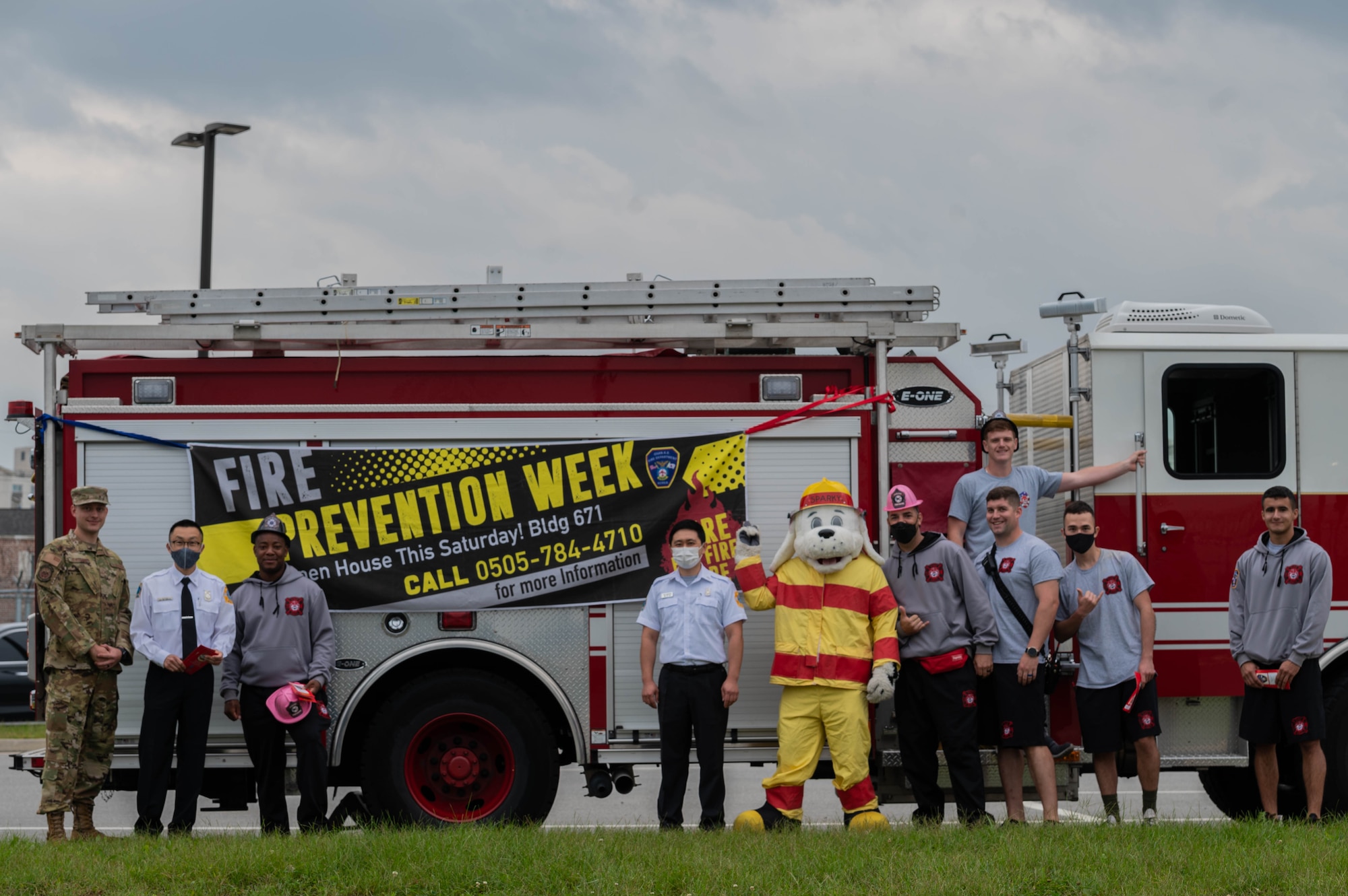 The 51st Fighter Wing Fire Department kicks off Fire Prevention Week by passing out brochures outside the Morin Gate at Osan Air Base