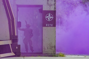 Two Airmen assigned to the 31st Security Forces Squadron participate in exercise Steadfast Nomad (STND) 2021 at Aviano Air Base, Italy, Sept. 22, 2021. STND is a NATO level force-on-force exercise that brought together tactical subject matter experts at all levels to help build a more lethal ground force to secure assets. (U.S. Air Force photo by Senior Airman Brooke Moeder)