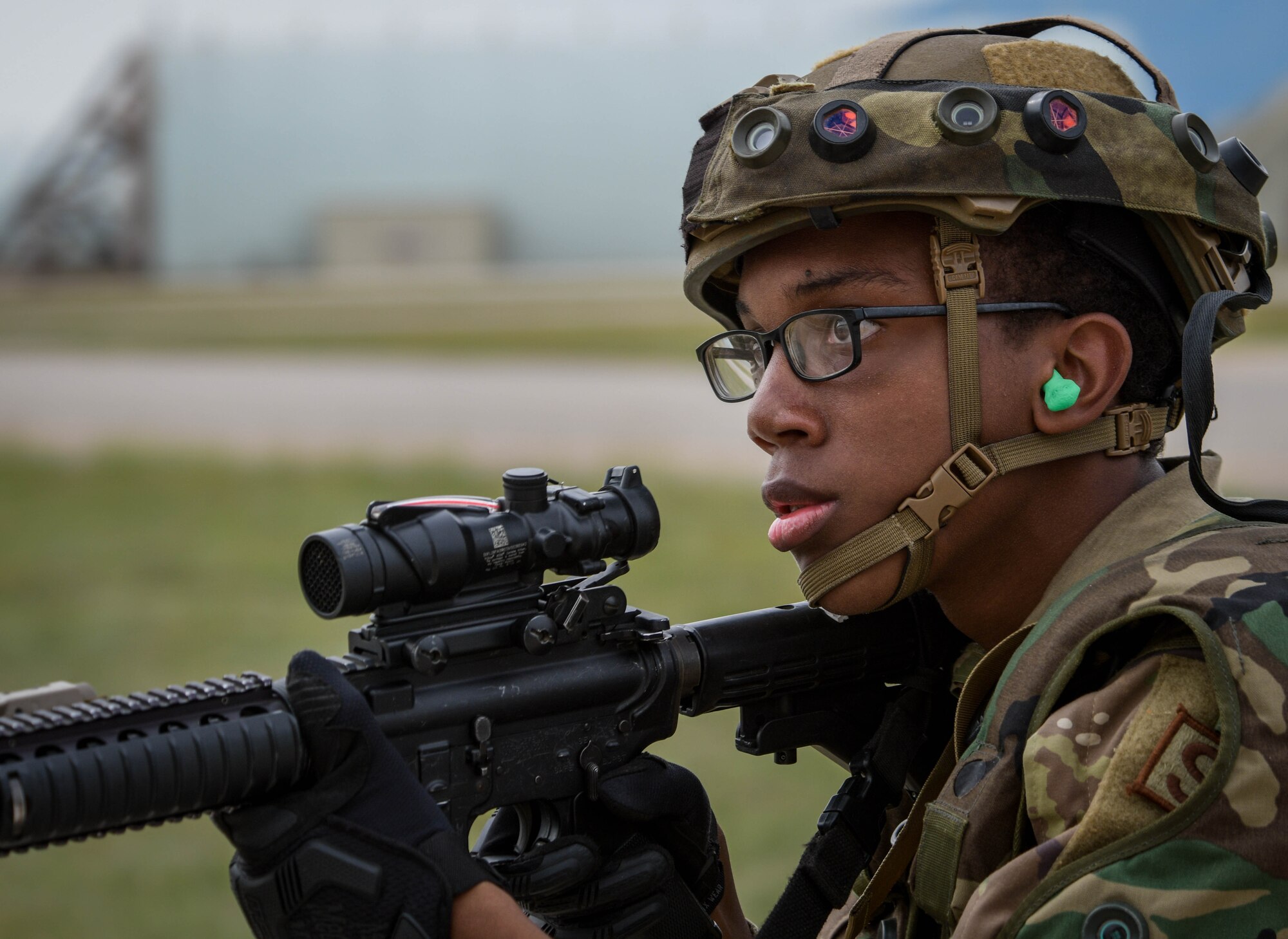 An Airman assigned to the 31st Security Forces Squadron participates in exercise Steadfast Nomad (STND) 2021 at Aviano Air Base, Italy, Sept. 22, 2021. During the exercise, the 31st SFS trained to tactically respond to threats on Aviano and practiced responding with more personnel, weapons, and armored HHMWVs. (U.S. Air Force photo by Senior Airman Brooke Moeder)