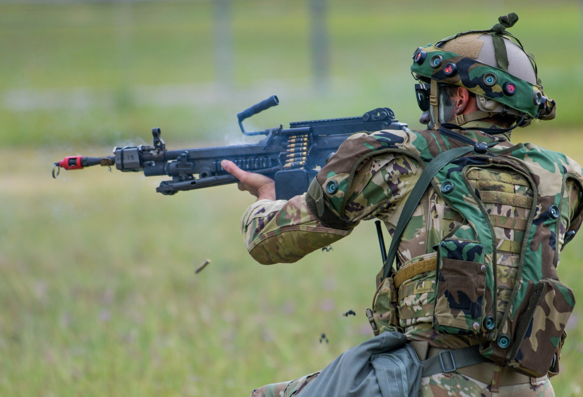 An Airman assigned to the 31st Security Forces Squadron shoots an M249 machine gun during exercise Steadfast Nomad (STND) 2021 at Aviano Air Base, Italy, Sept. 22, 2021. STND is an annual NATO level force-on-force exercise and was hosted by a U.S. main operating base for the first time. (U.S. Air Force photo by Senior Airman Brooke Moeder)