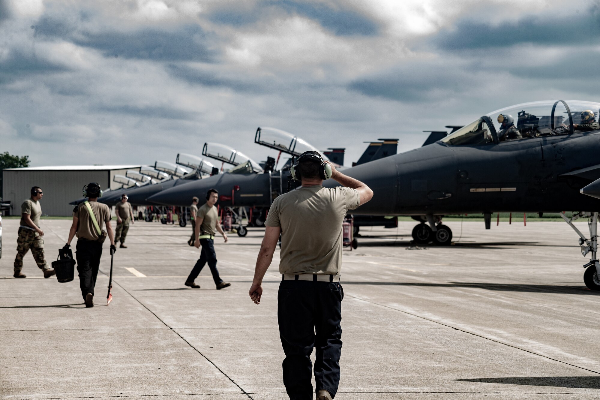 U.S. Air Force pilots and maintainers assigned to the 336th Fighter Squadron prepare F-15E Strike Eagle aircraft on the flightline at Terre Haute Regional Airport in preparation for exercise Jaded Thunder at Hulman Field Air National Guard Base, Ind., Aug. 15, 2021. Hulman Field, which is a dual-purpose, military and civilian airfield, is home to the Indiana National Guard’s 181st Intelligence Wing. (U.S. Air National Guard photo by Tech. Sgt. L. Roland Sturm)