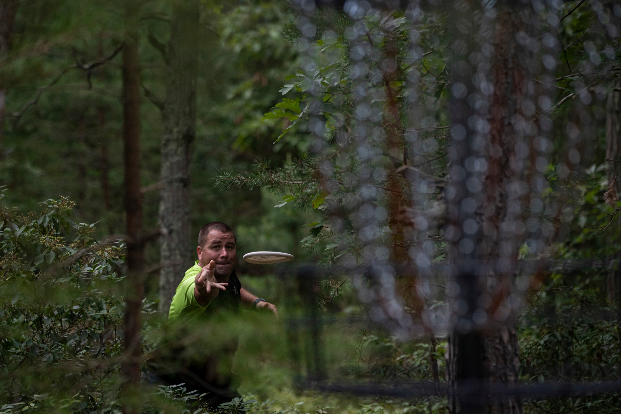 U.S. Air Force Senior Master Sgt. Jefferey Pitcher, a logistics specialist with Joint Force Headquarters-Air, throws a putting disc at the Laurel Pond Disc Golf Course on Joint Base McGuire-Dix-Lakehurst, N.J., Aug. 16, 2021.