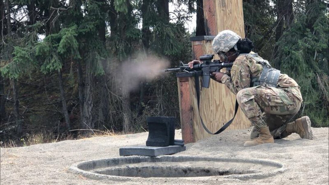 U.S. Army Reserve Spc. Michelle M. Mukasa, psychological operations analyst for the 12th Psychological Operations Battalion S-3, fires an M4 carbine from the kneeling position using qualification tables on Range 5, Joint Base Lewis McChord, Wash. Soldiers from the 361st Tactical Psychological Operations Company, based in Bothell, Wash., and the 12th POB, headquartered in Mountain View, Calif., conducted tactical psychological operations and collective training Aug. 14 – 23, 2021, Joint Base Lewis McChord, Wash. The exercise is part of the unit’s annual training, focusing on preparing the unit to operate in a multi-domain, hybrid-threat environment.