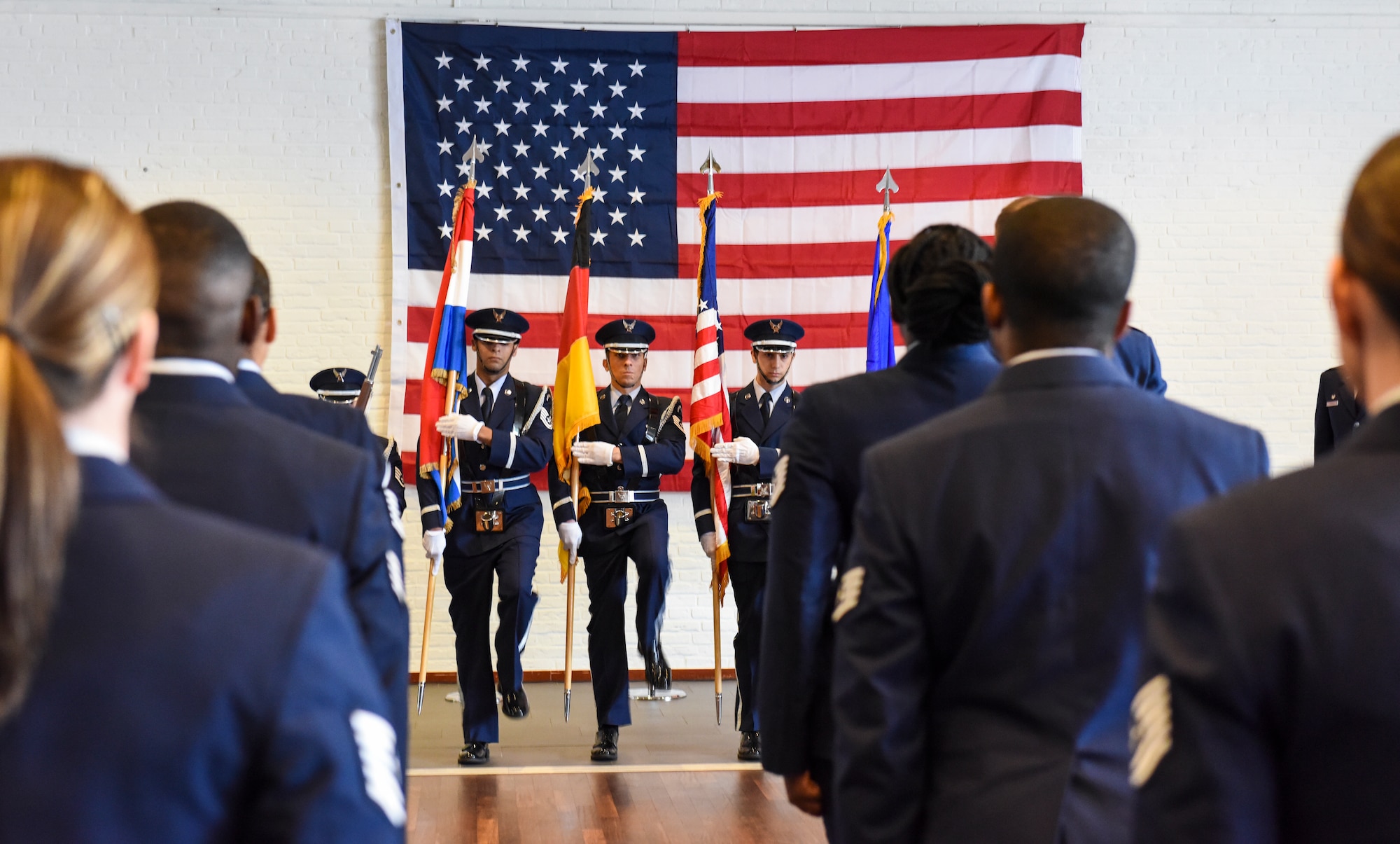 U.S. Air Force Airmen from the 470th Air Base Squadron Honor Guard march into position to present the colors at the 852nd Medical Squadron activation ceremony at Geilenkirchen NATO Air Base, Germany, Oct. 1, 2021.