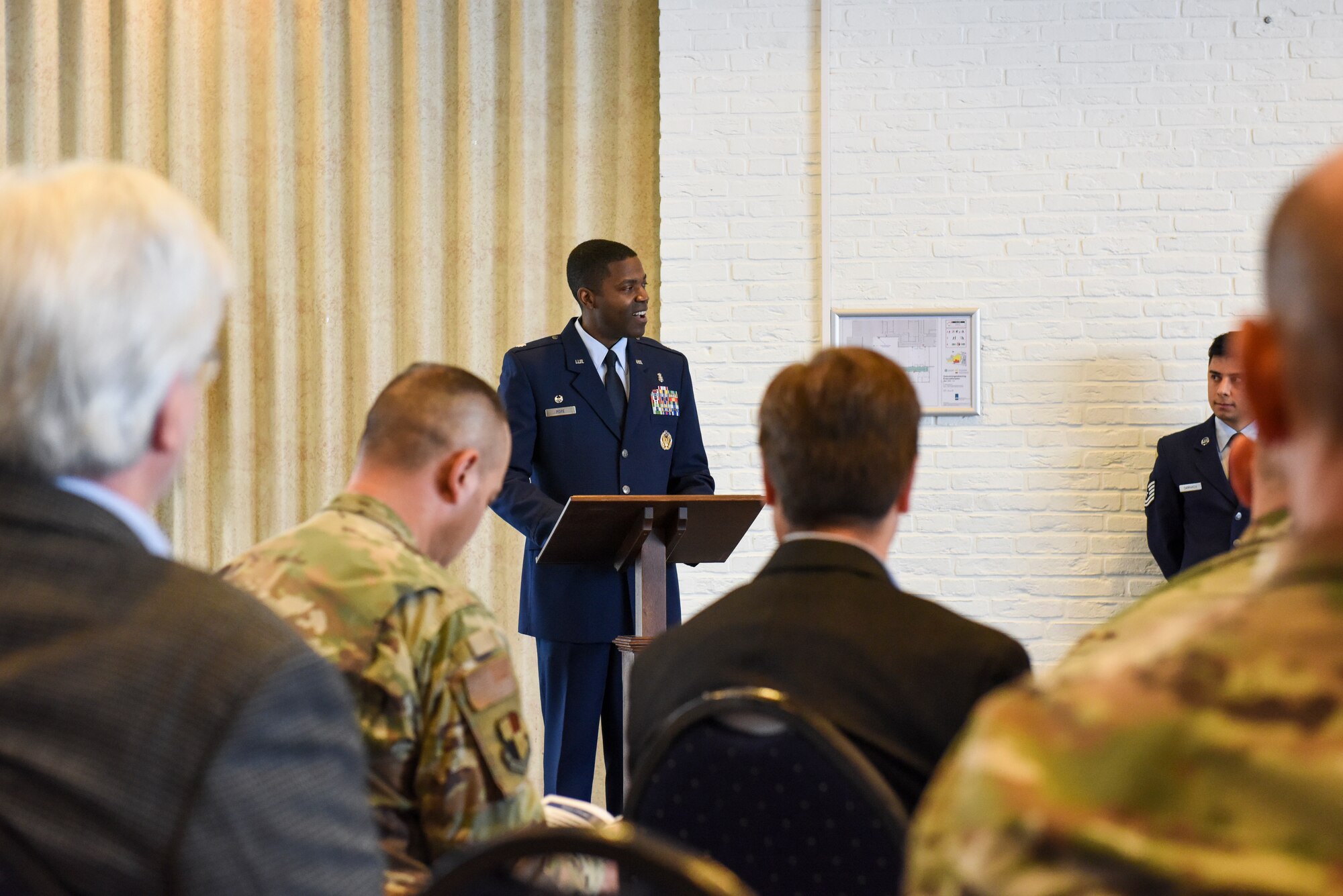 U.S. Air Force Lt. Col. Philip Pope, 852nd Medical Squadron commander, speaks to an audience during the 852nd MDS activation ceremony  at Geilenkirchen NATO Air Base, Germany, Oct. 1, 2021.