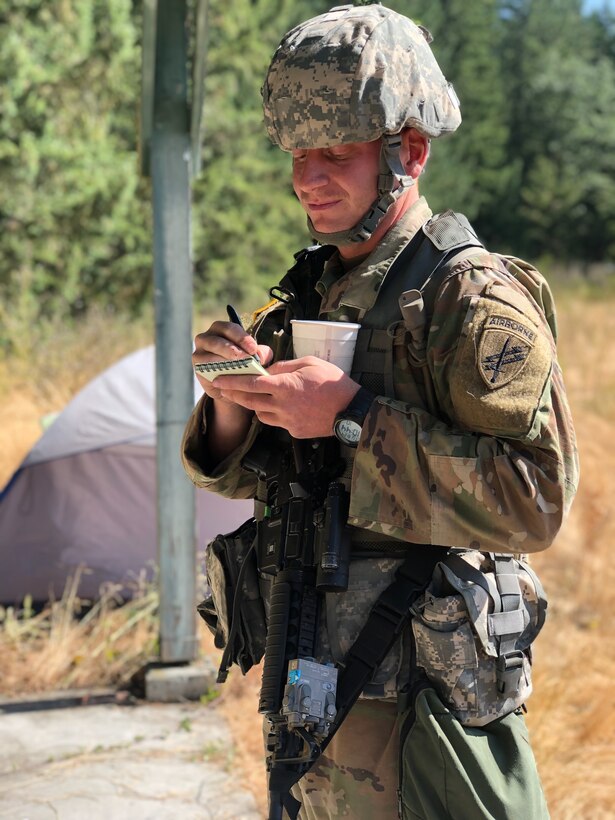 U.S. Army Reserve Spc. Samuel A. Young, a psychological operations specialist, Detachment 1270, takes notes in notional village during Psychological Operations Team Situational Training Exercise (STX). Soldiers from the 361st Tactical Psychological Operations Company, based in Bothell, Wash., and the 12th Psychological Operations Battalion, headquartered in Mountain View, Calif., conducted tactical psychological operations and collective training Aug. 14 – 23, 2021, Joint Base Lewis McChord, Wash. The exercise is part of the unit’s annual training, focusing on preparing the unit to operate in a multi-domain, hybrid-threat environment.