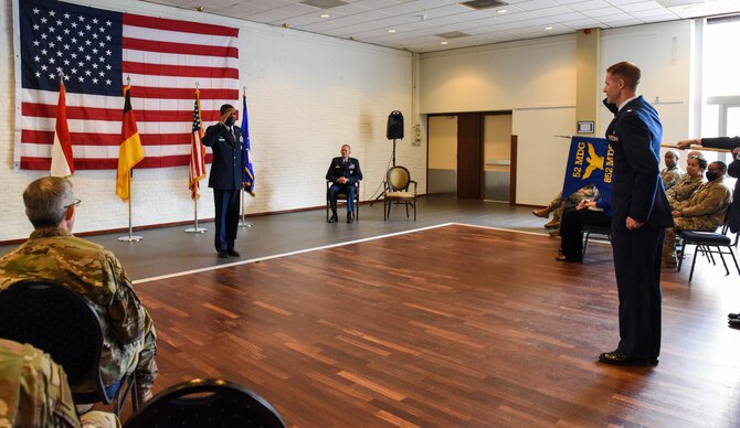 The newly activated 852nd Medical Squadron gives their first salute to their new commander, U.S. Air Force Lt. Col. Philip Pope, during the activation ceremony  at Geilenkirchen NATO Air Base, Germany, Oct. 1, 2021.