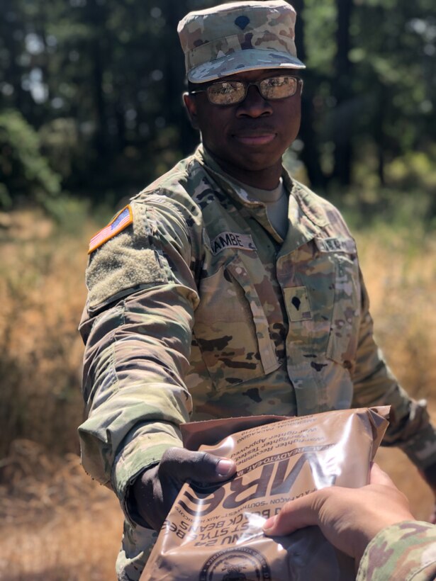 U.S. Army Reserve Spc. Hembashema G. Sambe, supply specialist for the 12th Psychological Operations Battalion S-4 passes out rations during the battalion’s Field Training Exercise (FTX). Soldiers from the 361st Tactical Psychological Operations Company, based in Bothell, Wash., and the 12th POB, headquartered in Mountain View, Calif., conducted tactical psychological operations and collective training Aug. 14 – 23, 2021, Joint Base Lewis McChord, Wash. The exercise is part of the unit’s annual training, focusing on preparing the unit to operate in a multi-domain, hybrid-threat environment.