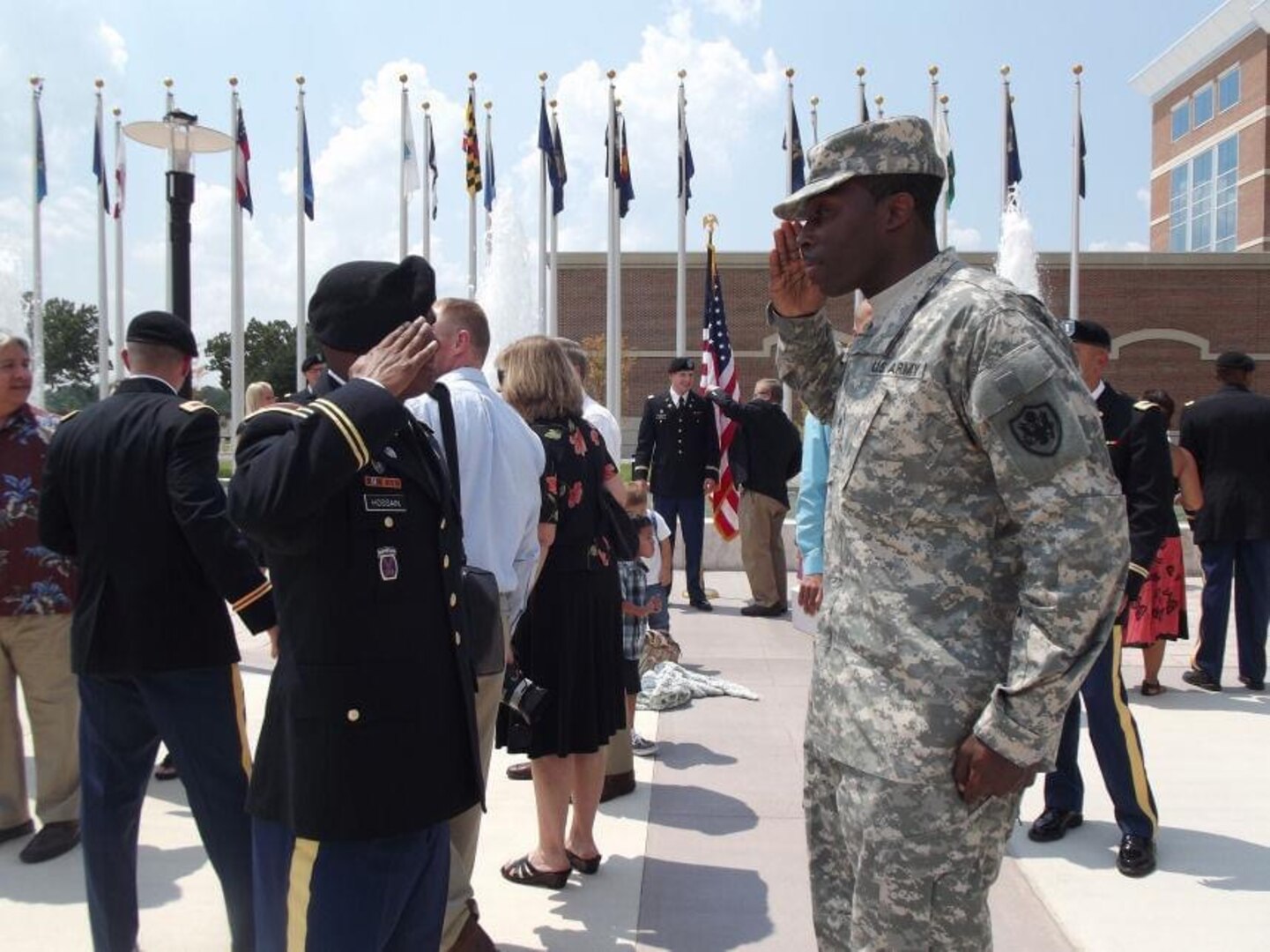 2nd Lt. Hossain receives his first salute as an officer from colleague and friend, then Staff Sgt. Scedric Moss, after OCS graduation, Fort Benning, Ga., Aug. 23, 2012.