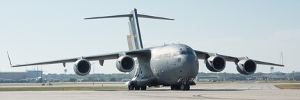Military transport aircraft taxies the runway