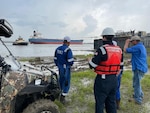 Coast Guard Salvage Engineering Response Team (SERT) provides technical analysis and assistance to salvors attempting to free grounded Genesis Marine barges on the Bonnet Carre Spillway Sept. 6, 2021. The SERT worked alongside the salvage master and representatives from T&T Salvage and Genesis Marine to free the barges. (U.S. Coast Guard photo)