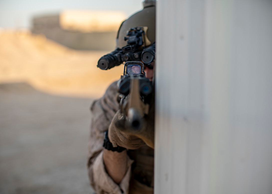 CAMP BUEHRING, Kuwait (Oct. 1, 2021) Reconnaissance Marine assigned to the All Domain Reconnaissance Detachment, 11th Marine Expeditionary Unit (MEU), sets security with an M4A1 carbine during a simulated raid, Oct. 1. The 11th MEU and Essex Amphibious Ready Group are deployed to the U.S. 5th Fleet area of operations in support of naval operations to ensure maritime stability and security in the Central Region, connecting the Mediterranean and Pacific through the Western Indian Ocean and three strategic choke points. (U.S. Marine Corps photo by Cpl. Israel Chincio/Released)