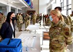 Under Secretary of the Air Force Gina Ortiz Jones walks with Col. Terry McClain, 433rd Airlift Wing commander, to view the mandatory COVID-19 vaccination process at Joint Base San Antonio-Lackland, Texas, Oct. 2, 2021. (U.S. Air Force photo by Tech. Sgt. Samantha Mathison)