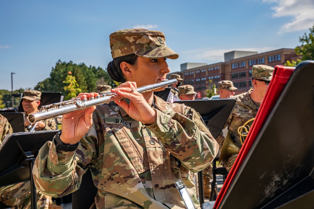 A soldier plays the flute.