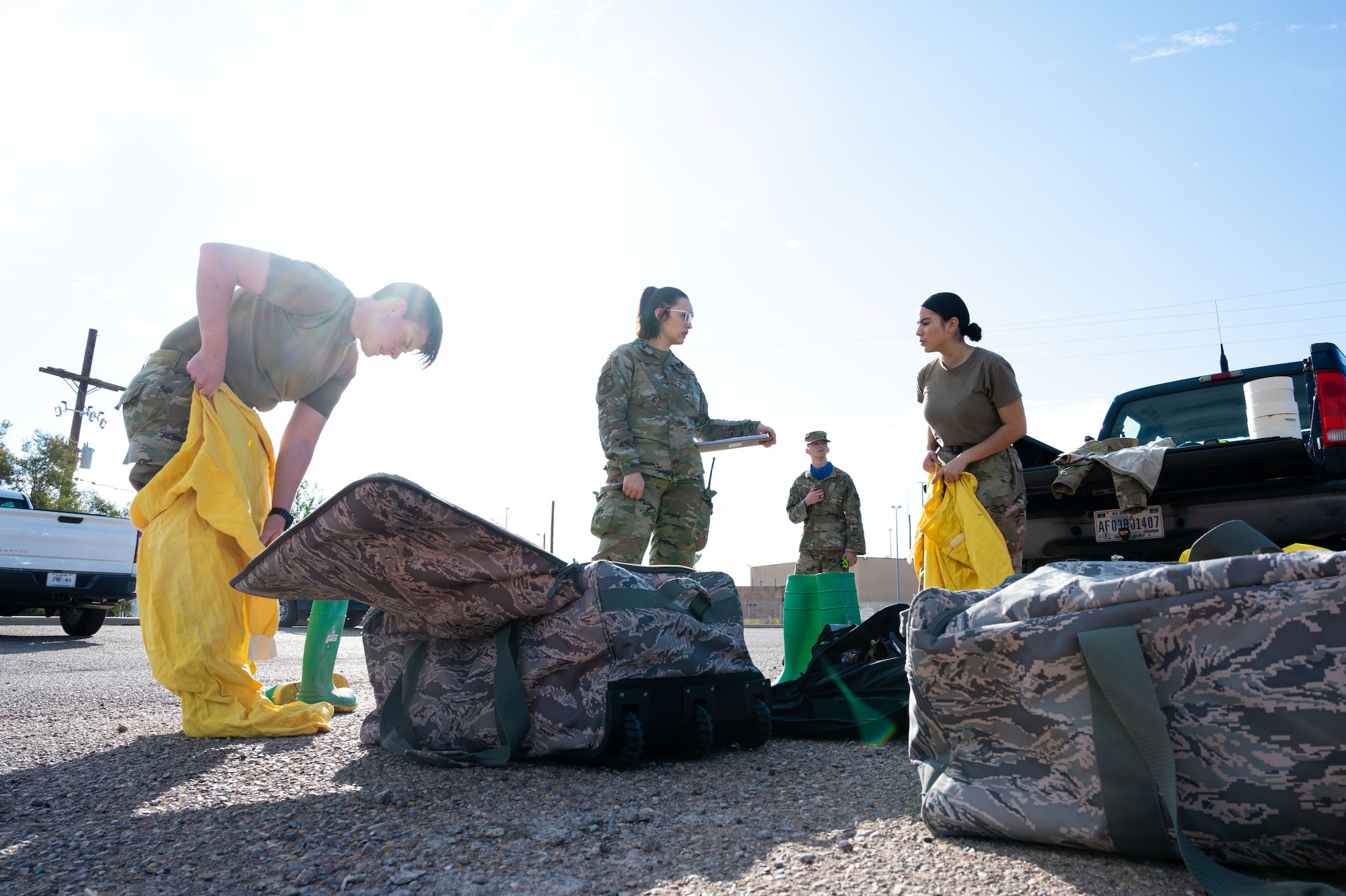 (From left to right) Tech. Sgt. Lisa Sandahl, 49th Civil Engineer Squadron emergency management noncommissioned officer in charge; Airman 1st Class Kamryn Khalaj and Airman 1st Class James Partin, 49th CES emergency management journeymen and Airman 1st Class Erika Vega, 49th CES apprentice, prepare for a radiological survey exercise Oct. 1, 2021 on Holloman Air Force Base, New Mexico. The 49th CES emergency management flight conducts radiological survey exercises annually. (U.S. Air Force photo by Tech. Sgt. BreeAnn Sachs)