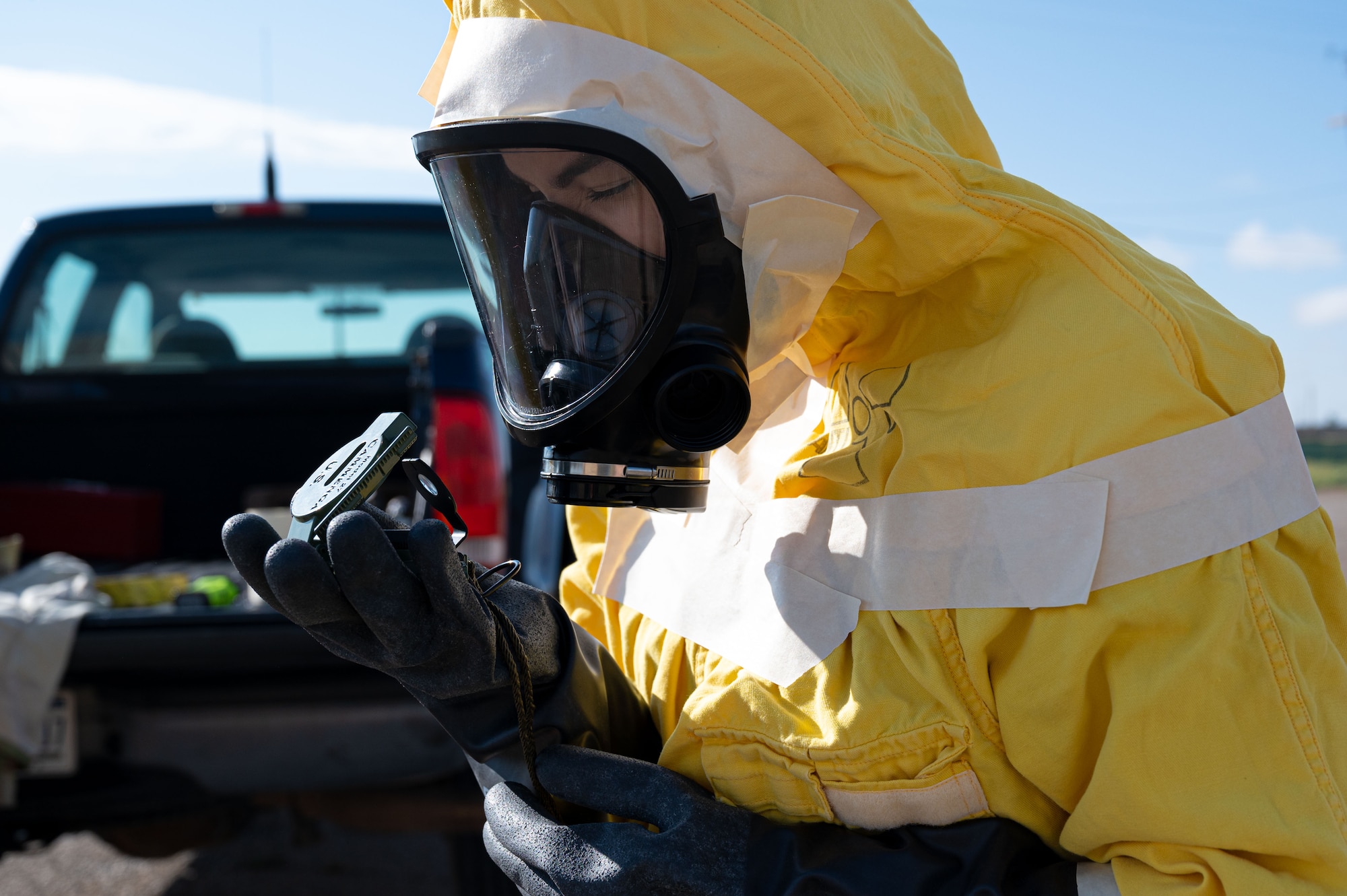 Airman 1st Class Erika Vega, 49th Civil Engineer Squadron emergency management apprentice, reads a compass during a radiological survey exercise Oct. 1, 2021 on Holloman Air Force Base, New Mexico. Cardinal directions are used as survey teams move in and out of an area of contamination so the command and control personnel can accurately track their position. (U.S. Air Force photo by Tech. Sgt. BreeAnn Sachs)