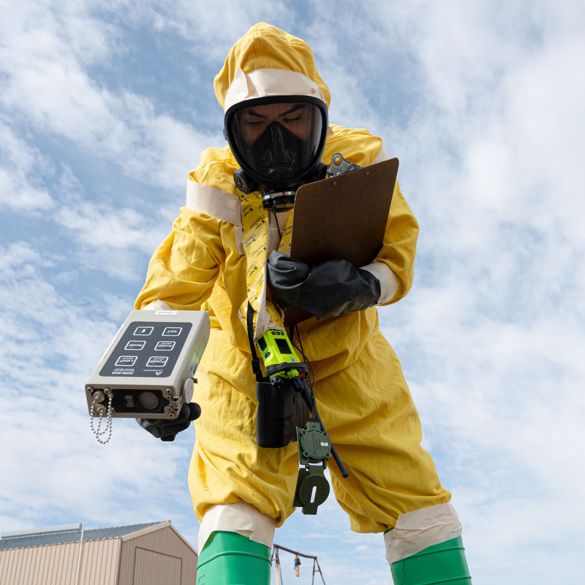 Airman 1st Class Erika Vega, 49th Civil Engineer Squadron emergency management apprentice, detects possible alpha radiation during a radiological survey exercise Oct. 1, 2021 on Holloman Air Force Base, New Mexico. During the exercise, participants practiced the proper wear of personal protective equipment, survey team operations and use of ADM-300 radiation detection meters. (U.S. Air Force photo by Tech. Sgt. BreeAnn Sachs)