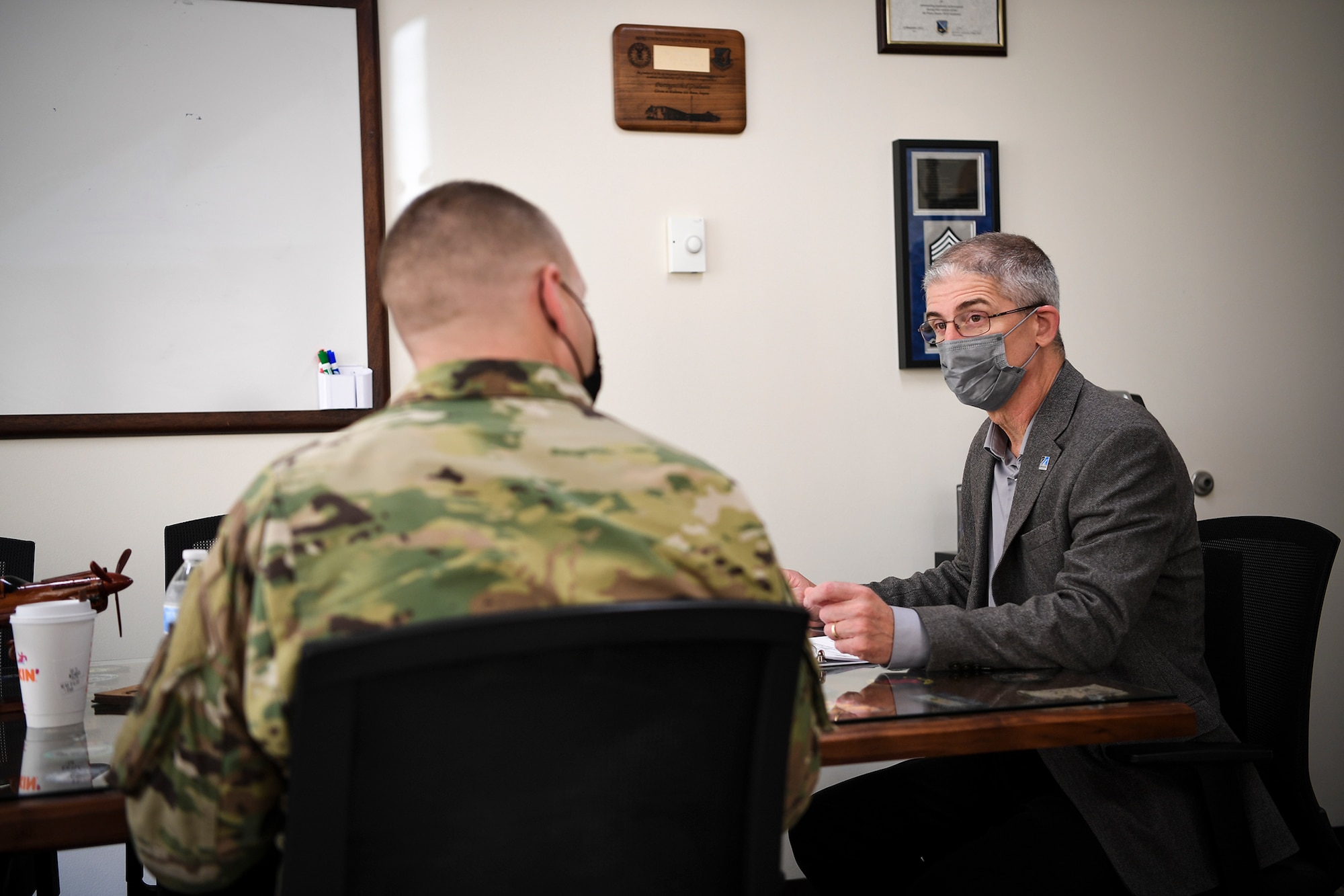 Installation command chief speaks to honorary command chief for the 66th Air Base Group