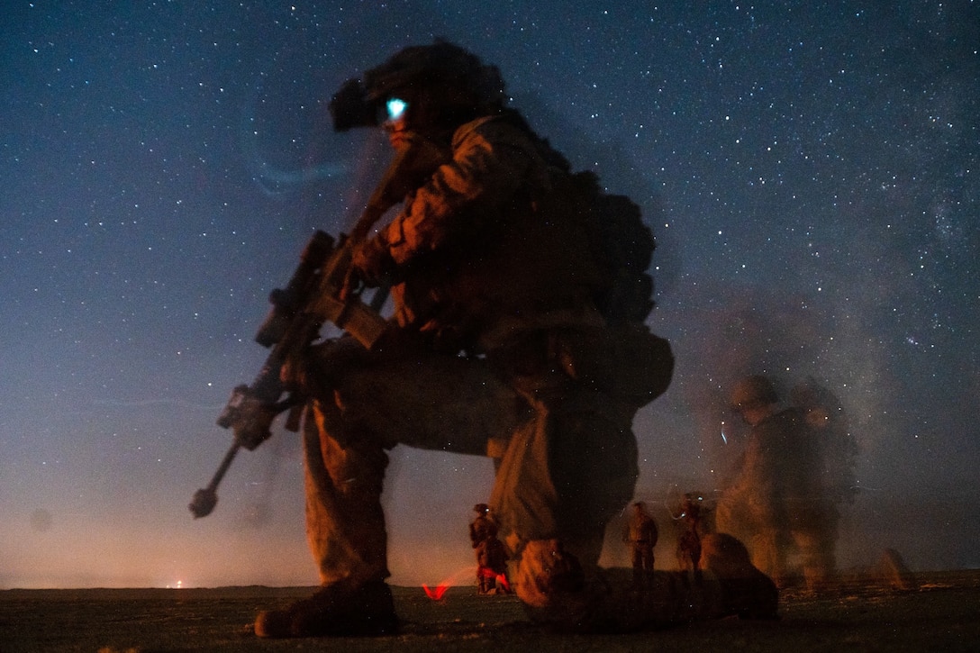 Marine Corps Lance Cpl. Jacob Ucinski, a rifleman with Charlie Company, Battalion Landing Team 1/1, 11th Marine Expeditionary Unit, sets security with an M27 Infantry Automatic Rifle during a tactical recovery of aircraft and personnel exercise, Sept. 28, 2021. The Essex Amphibious Ready Group and 11th MEU are deployed to the U.S. 5th Fleet area of operations in support of naval operations to ensure maritime stability and security in the Central Region, connecting the Mediterranean and Pacific through the Western Indian Ocean and three strategic choke points.