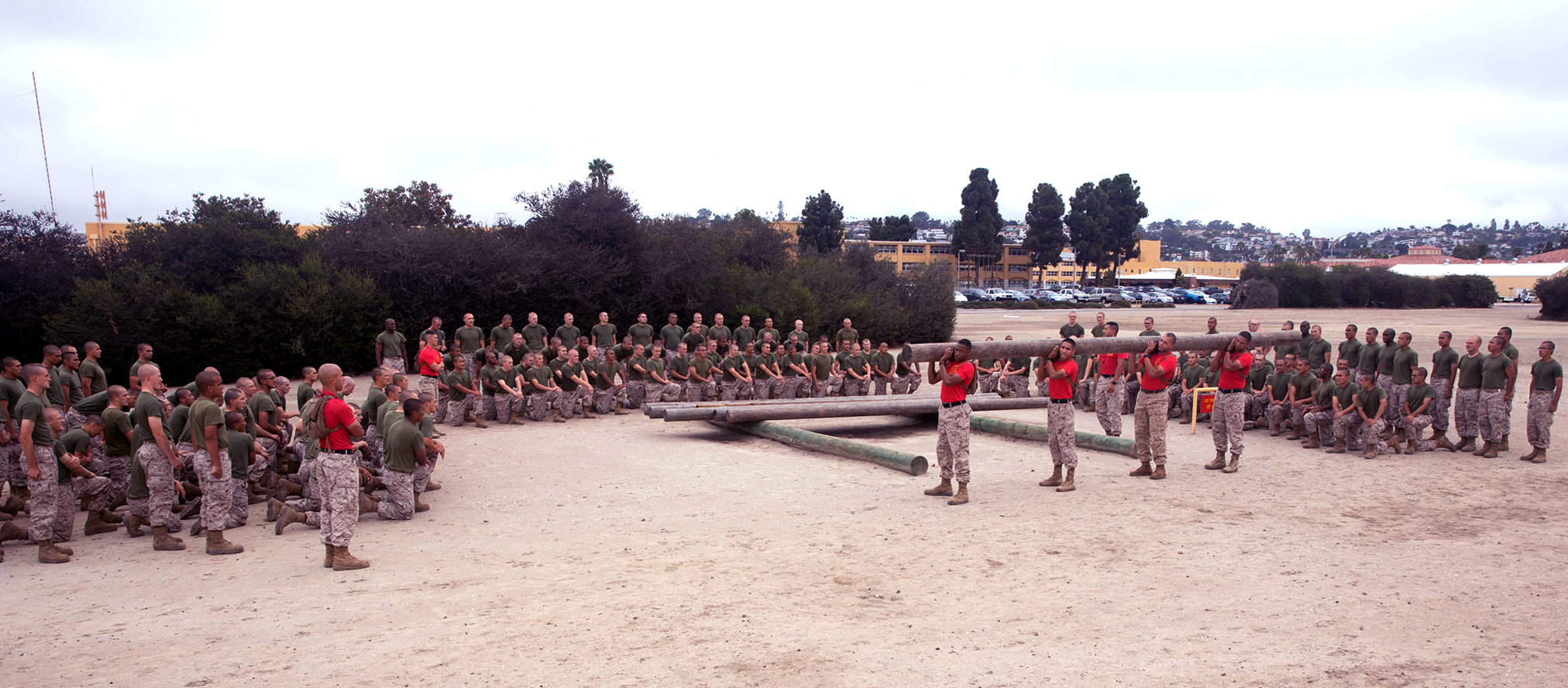 U.S. Marine Corps drill instructors with Bravo Company, 1st Recruit Training Battalion, demonstrate exercises during log drills at Marine Corps Recruit Depot, San Diego, Sept. 27, 2021