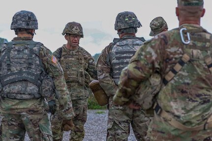 Sgt. Maj. of the Army Michael A. Grinston provides feedback to Soldiers
