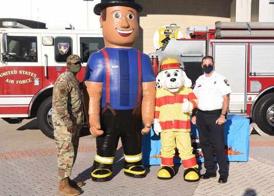 U.S. Air Force Col. James Finlayson, 17th Training Wing vice commander, stands with 17th Civil Engineer Squadron personnel after the Fire Prevention Week proclamation signing on Goodfellow Air Force Base.