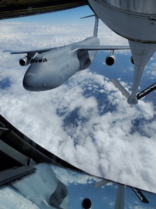 A 433rd Airlift Wing C-5M Super Galaxy from Joint Base San Antonio-Lackland, Texas pulls away after taking on fuel during a training flight over Texas. This view is from the boom operator’s station in the rear of a 507th Air Refueling Wing KC-135R Stratotanker from Tinker Air Force Base, Oklahoma. (Courtesy photo)
