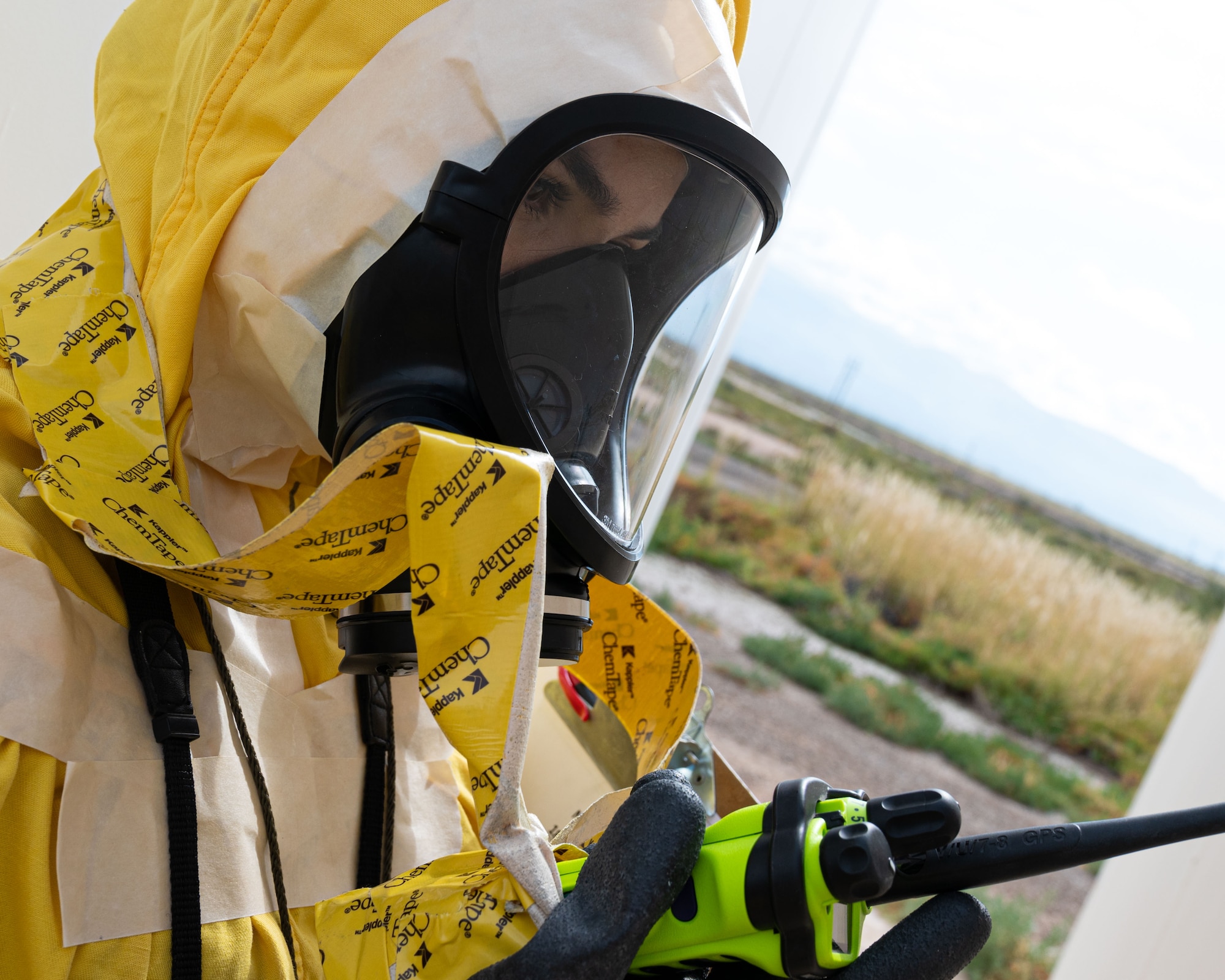 Airman 1st Class Erika Vega, 49th Civil Engineer Squadron emergency management apprentice, makes a radio call during a radiological survey exercise Oct. 1, 2021 on Holloman Air Force Base, New Mexico. Land mobile radios are used so survey teams can report their location, detected contamination and other pertinent information to the command and control personnel during an emergency event. (U.S. Air Force photo by Tech. Sgt. BreeAnn Sachs)