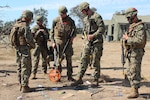 Civil Engineer Corps (CEC) Officers School Basic Qualification Course students use a terrain model