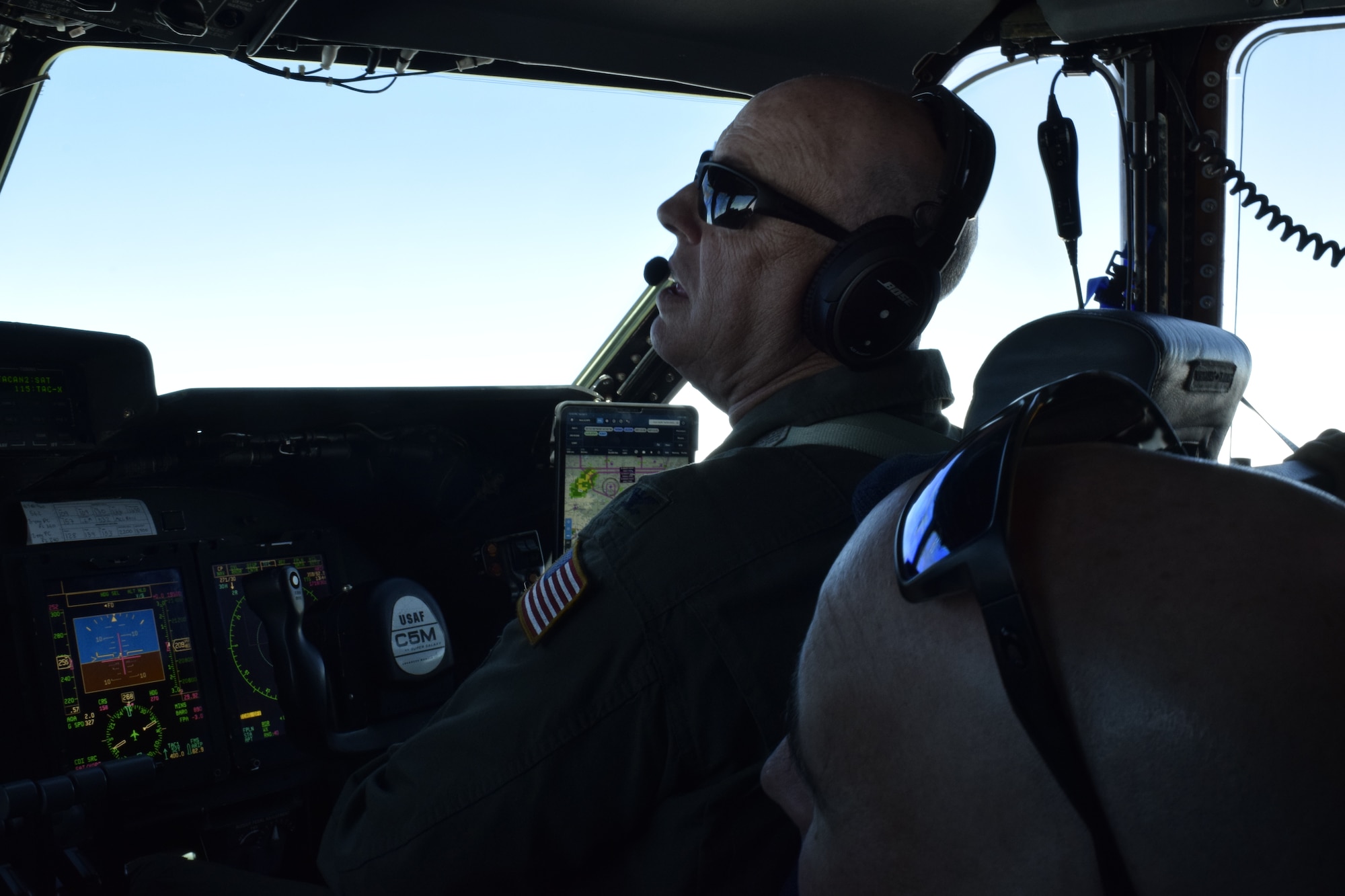 Col. James C. “JC” Miller, 433rd Operations Group commander, mentors a junior pilot (out of frame) during a civic leader local flight over Texas in a C-5M Super Galaxy cargo aircraft Oct. 2, 2021. Local civilian community leaders are invited to participate in unit activities to promote understanding of the military mission. (U.S. Air Force photo by Senior Airman Brittany Wich)
