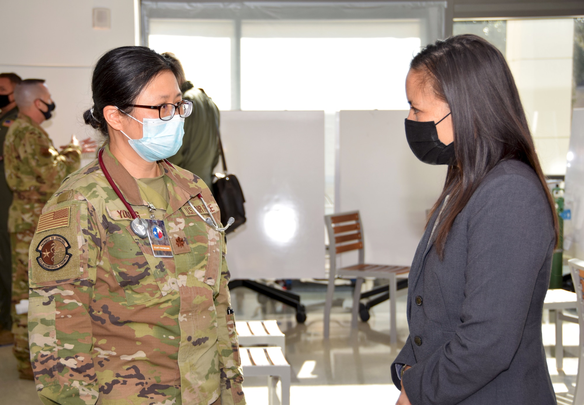 Maj. Alisha Young, 433rd Aeromedical Staging Squadron critical care air transport team physician, speaks with Under Secretary of the Air Force Gina Ortiz Jones during her visit to 433rd Airlift Wing members at Wilford Hall Ambulatory Surgical Center, Joint Base San Antonio-Lackland, Texas, Oct. 2, 2021. (U.S. Air Force photo by Tech. Sgt. Samantha Mathison)