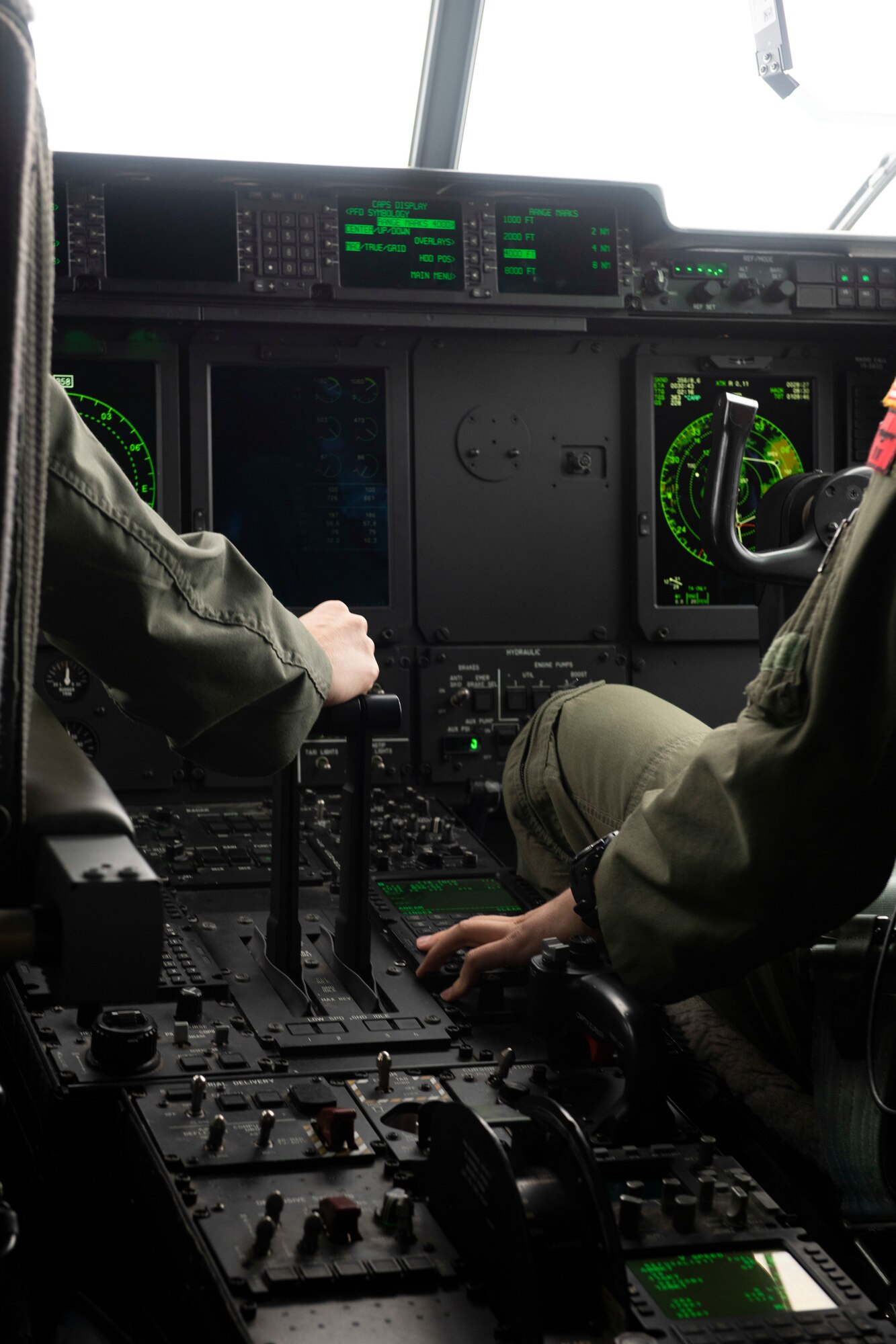 Lt. Col. Kira Coffey, 36th Airlift Squadron director of operations, left, and Capt. Garrett Mazachek, 36th AS pilot, operate a C-130J Super Hercules at Yokota Air Base, Japan, Oct. 1, 2021. Coffey and Mazachek supported four annual and wing level award winners on their flight and showcased a pilot’s duty during flight. (U.S. Air Force photo by Staff Sgt. Joshua Edwards)