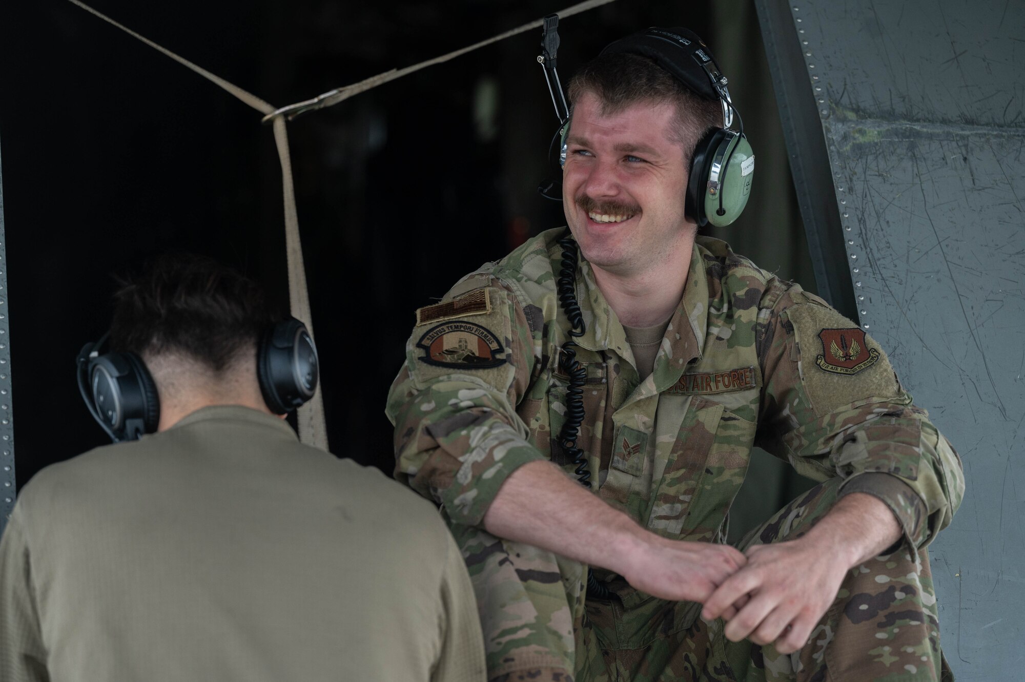 Airmen speak to each other.