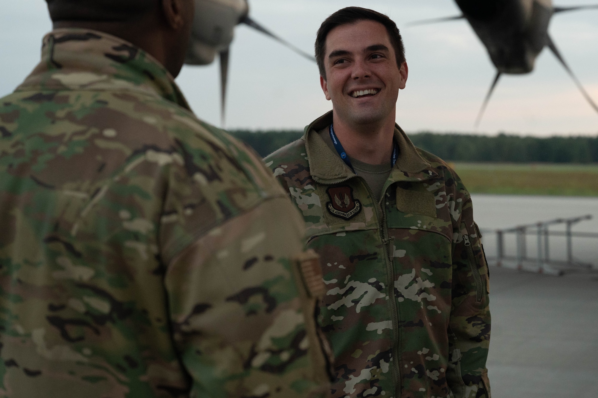 An Airman speaks with another Airman.