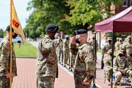 1st Sgt. Charles L. York, first sergeant, Headquarters and Headquarters Company, Special Troops Battalion, 1st Theater Sustainment Command, renders a salute for the return of the guidon to the bearer after assuming responsibility of HHC during the company's change of responsibility ceremony at Fort Knox, Kentucky, Oct 1., 2021. The change of responsibility ceremony symbolizes the transfer of responsibility from the outgoing first sergeant to the incoming first sergeant.