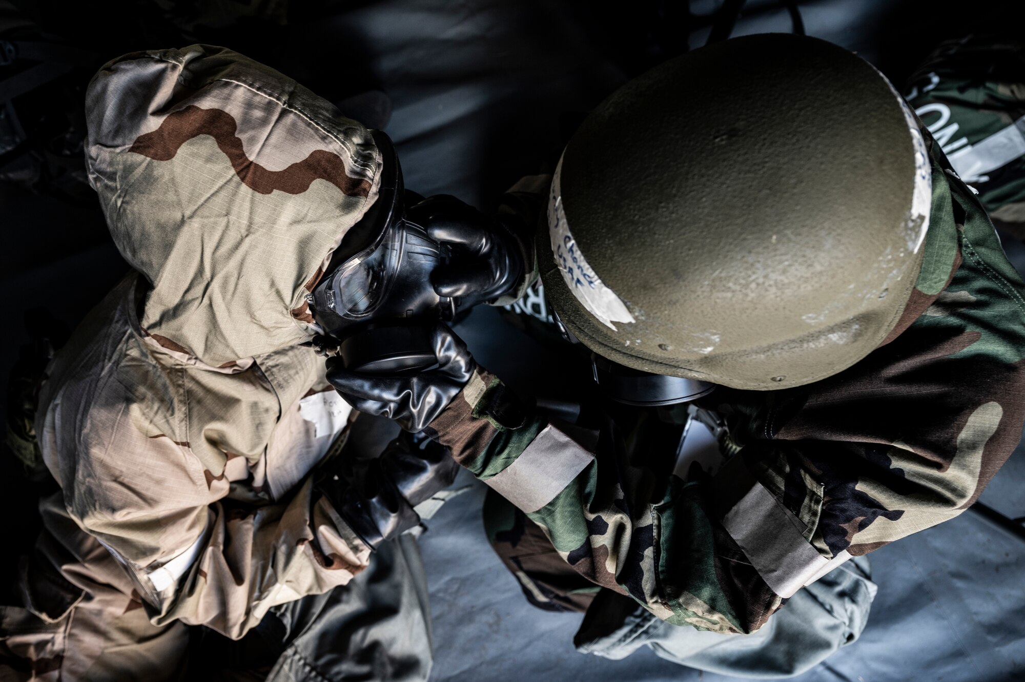 Airmen assigned to the 911th Airlift Wing don their Mission-Oriented Protective Postures (MOPP) gear during an exercise at the Pittsburgh International Airport Air Reserve Station, Pennsylvania, Sept. 9, 2021.