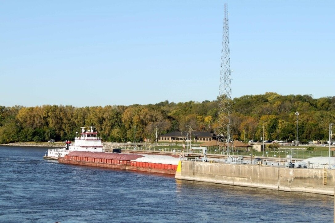Tow entering Lock 14 in front of the Mississippi River Project Office in Pleasant Valley, Iowa.