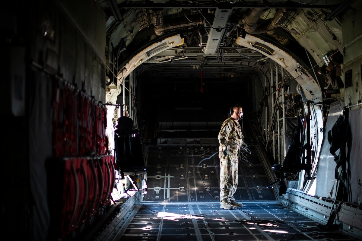 U.S. Air Force Master Sgt. Douglas Benton, a loadmaster with the 187th Airlift Squadron, stands in the back of a C-130 Hercules aircraft assigned to the 153d Airlift Wing, Wyoming Air National Guard as part of Exercise Southern Strike at the Mississippi National Guard’s Combat Readiness Training Center Gulfport, Miss., April 22, 2021. Southern Strike is an annual training exercise hosted by the Mississippi National Guard to increase combat readiness across all branches of the U.S. Military. (Temporary unmasking for service members is due to mission requirements.)