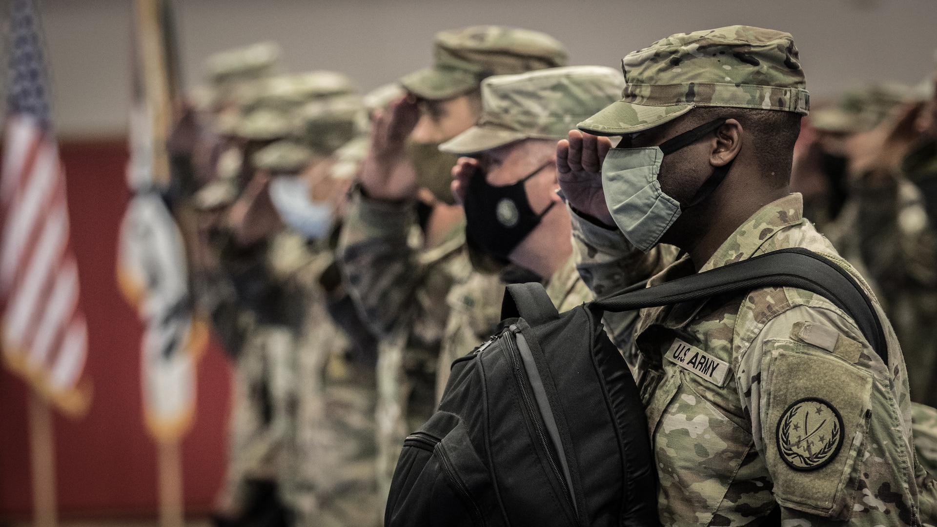 Service members in line saluting