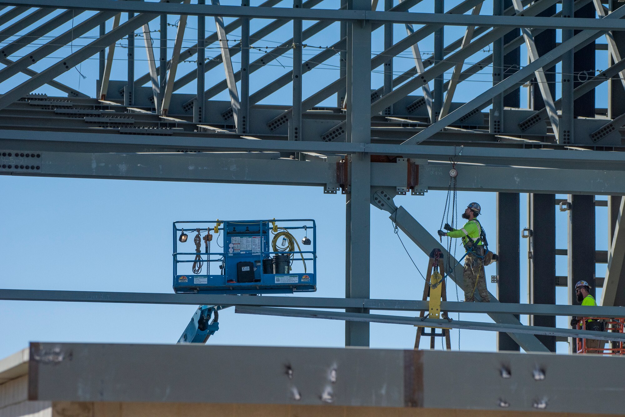 A Walsh Construction crewman places a support beam during construction of the KC-46A Pegasus 3-bay maintenance hangar Sept. 30, 2021, at Travis Air Force Base, California. The facility will be utilized for the maintenance and upkeep of Travis AFB’s KC-46 tanker jet inventory upon the hangar’s completion in February 2023. (U.S. Air Force photo by Heide Couch)