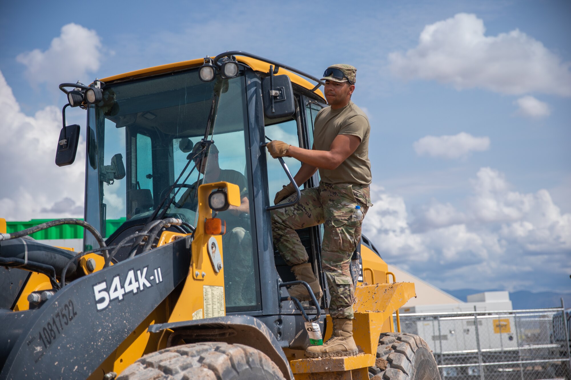 Airmen attached to Task Force-Holloman move a prayer tent and its accessories to a new location within Aman Omid Village on Holloman Air Force Base, New Mexico, Sept. 27, 2021. The Department of Defense, through U.S. Northern Command, and in support of the Department of State and Department of Homeland Security, is providing transportation, temporary housing, medical screening, and general support for at least 50,000 Afghan evacuees at suitable facilities, in permanent or temporary structures, as quickly as possible. This initiative provides Afghan evacuees essential support at secure locations outside Afghanistan. (U.S. Army photo by Pfc. Anthony Sanchez)