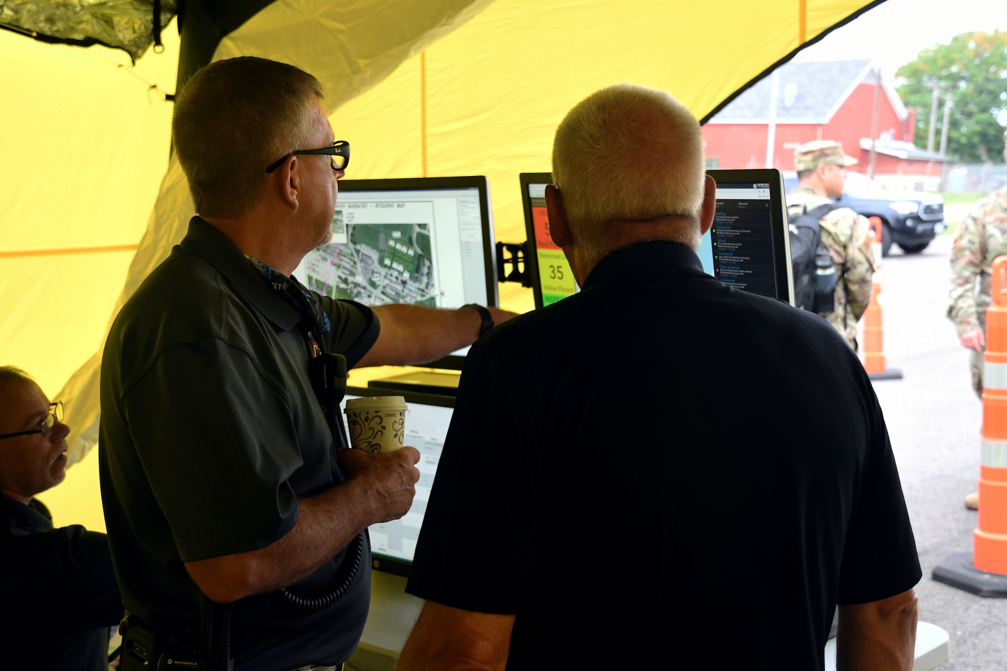 Volunteers keep track of structural assessments at the command post during a Missouri Structural Assessment and Visual Evaluation (SAVE) Coalition exercise Oct. 2, 2021 at Jefferson Barracks Air National Guard Base, Missouri. The exercise strengthened partnerships between civilian and state agencies that would be called to respond to a potential earthquake. (U.S. Air National Guard photo by Tech. Sgt. Stephanie Mundwiller)