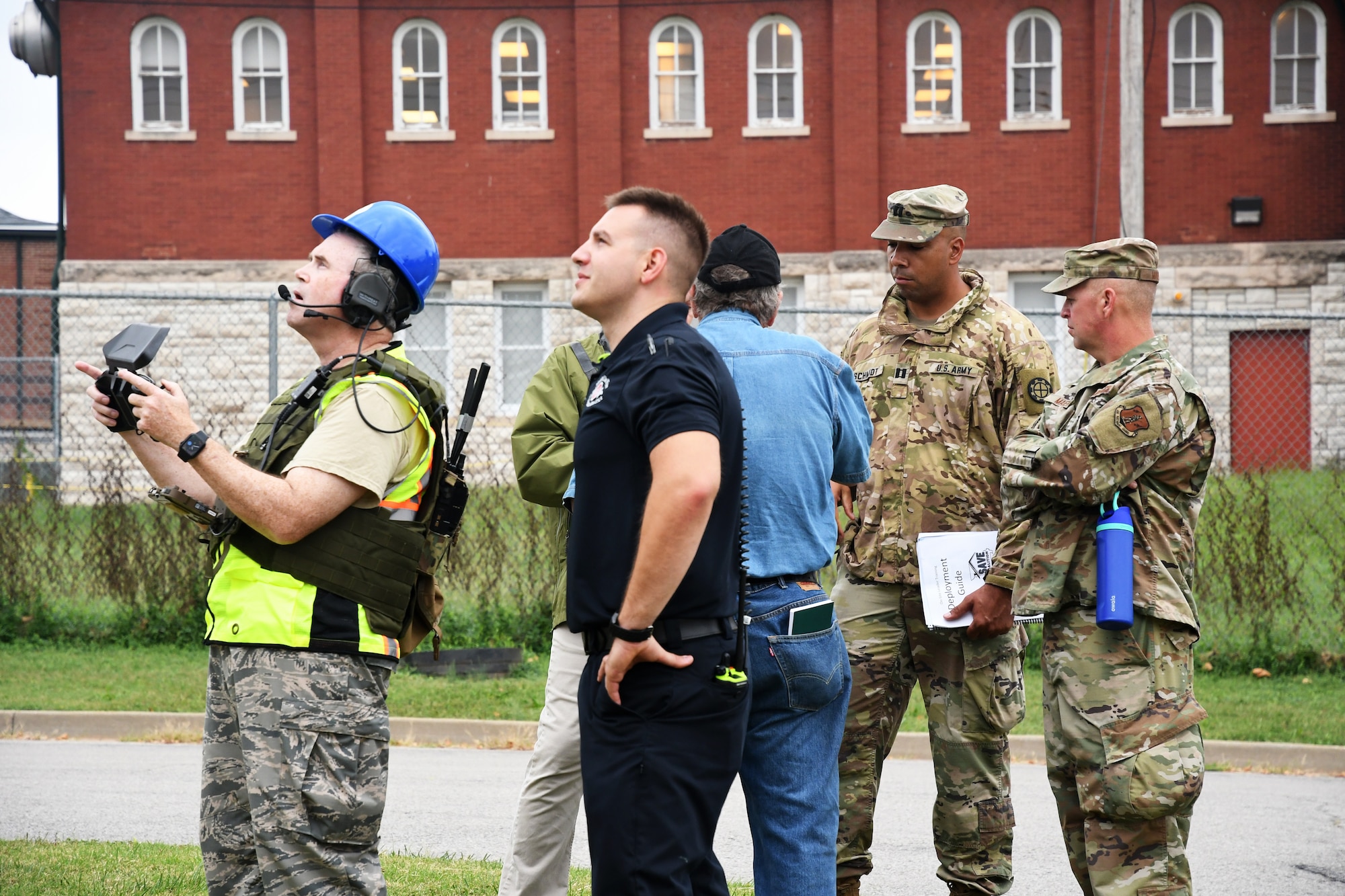 A Civil Air Patrol unmanned aerial system pilot captures aerial views of "damaged" buildings while other team members evaluate potential structural instability during a Missouri Structural Assessment and Visual Evaluation (SAVE) Coalition exercise Oct. 2, 2021 at Jefferson Barracks Air National Guard Base, Missouri. The exercise strengthened partnerships between civilian and state agencies to be able to respond to a potential earthquake. (U.S. Air National Guard photo by Tech. Sgt. Stephanie Mundwiller)