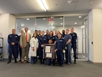 Members of Base National Capital Region receive their specific Health Clinic of the Year award, July 21, 2021. Every Coast Guard clinic will be recognized as the clinic of the year for 2020 based on how well the medical community responded to a global pandemic as well as hurricanes in 2020. U.S. Coast Guard photo by Keisha Reynolds.